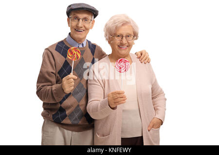 Senior Paar mit Lutscher auf weißem Hintergrund Stockfoto