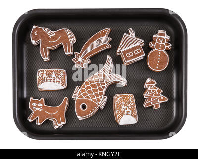 Schönen traditionellen handgemachten Weihnachten Lebkuchen. Hand sweet Cookies auf Backblech gestapelt eingerichtet. Auf weissem Hintergrund. Stockfoto