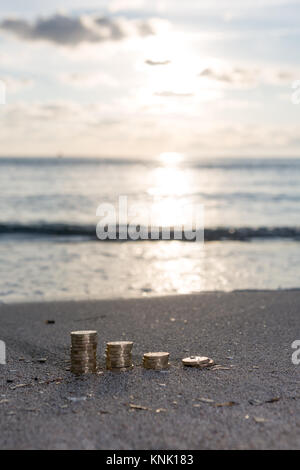 Bild von vier Pfähle British Pound Münzen. UK Geld, neue Pfund in ein warmes Licht. Stockfoto