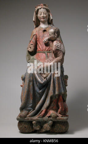 Eine deutsche Eichenskulptur aus Regensburg, um 1280, die die Jungfrau Maria auf dem Thron mit dem Christuskind darstellt, gemalt und geschnitzt für religiöse Hingabe. Stockfoto