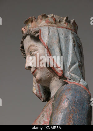 Eine um 1280 entstandene Eichenskulptur aus Regensburg, die die Jungfrau Maria auf dem Thron mit dem Christuskind darstellt, gemalt für religiöse Hingabe. Stockfoto