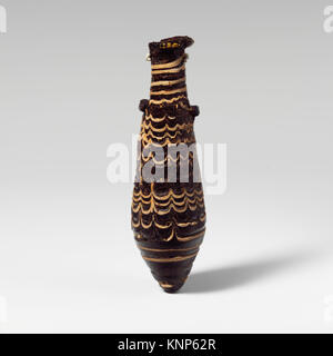 Eine Glasalabastron (Parfümflasche) aus der MET, Katalognummer DP151258 249819, die die alte Glashandwerkskunst und die dekorativen Techniken veranschaulicht. Stockfoto