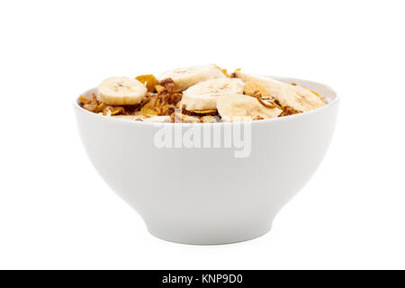 Schüssel mit Müsli und Banane Stockfoto