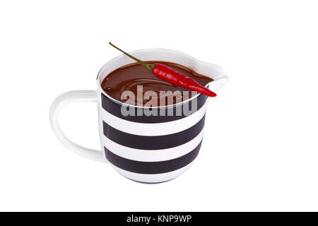 Chilly Pepper und Tasse Schokolade Stockfoto