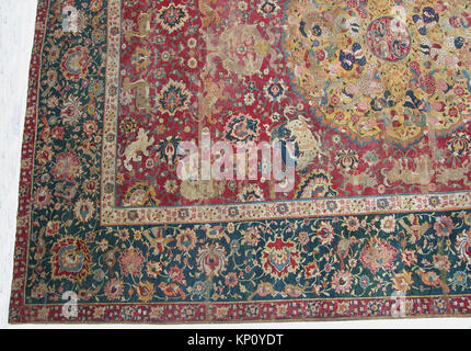 Ein Teppich aus der Sammlung des Metropolitan Museums, Katalognummer wb-17.120.127c 446954. Dieses Textil zeigt dekoratives Design und handwerkliches Können, das als Beispiel für historische und künstlerische Webkunst erhalten wurde. Stockfoto