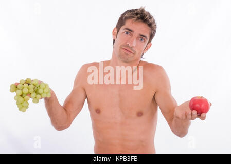 Model Release, Ratloser Mann, 35 +, Mit Obst in der Hand - Mann mit Früchten in Händen Stockfoto