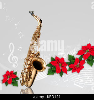 Mit Noten und roten Weihnachtsstern Blume Weihnachtsverzierung auf grauem Hintergrund Saxophon Stockfoto