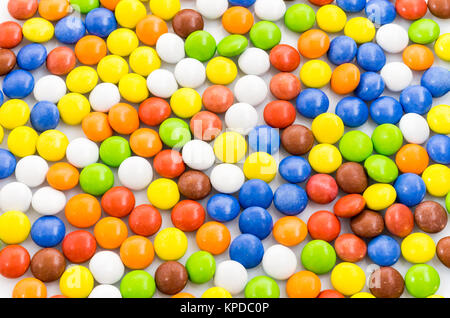 Mehrfarbiger Hintergrund. Hellen bunten Hintergrund der Pralinen. Viele kleine Pillen. Stockfoto