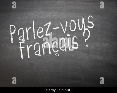 Lernen Sprache - Französisch. Französisch lernen Sprache Konzept der Lehrer oder Schüler schreiben Parlez-vous Francais (Französisch sprechen) auf blackboard/Stationsübersicht. Stockfoto