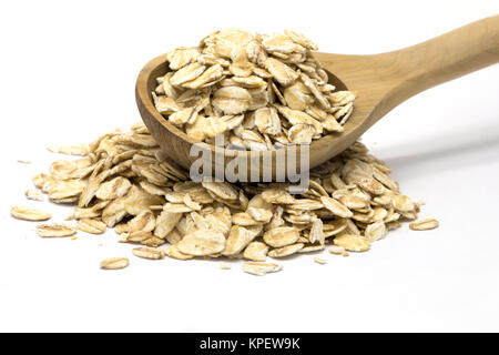 Haferflocken in Löffel aus Holz Stockfoto