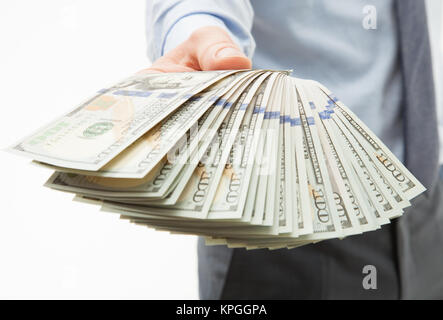 Des Menschen Hände halten Dollar Banknoten Stockfoto