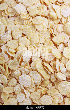 Corn flakes Textur closeup Muster als Hintergrund. Frühstück essen Foto. Getreide. Stockfoto