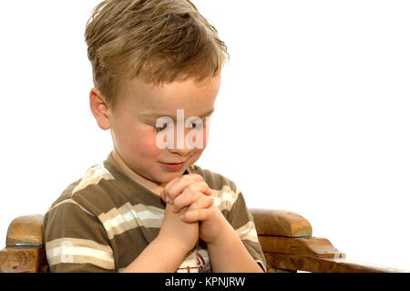 Kleiner Junge beten Stockfoto