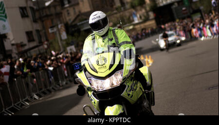 Polizei Schottland Motorrad officer Begleitung Radfahrer in einem Rennen bei den Commonwealth Games 2014 in Glasgow, Glasgow, Schottland, 31. Juli 2014 Stockfoto