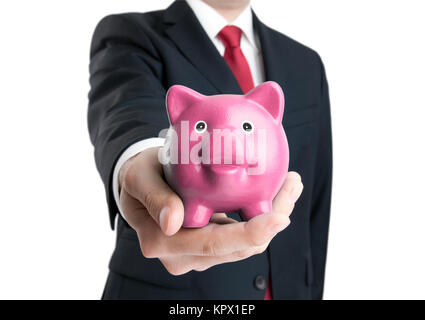 Mann mit Sparschwein in der hand. Clipping-Pfad enthalten. Stockfoto