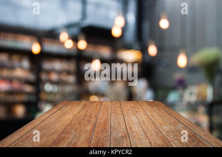 Perspektive Holz- auf Coffee Shop verschwommenen Hintergrund mit Bokeh Stockfoto