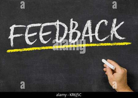 Text auf der Tafel - Feedback Stockfoto