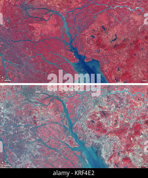 In 1979, China zwei Sonderwirtschaftszonen rund um das Pearl River Delta, nördlich von Hongkong. Dieses Bild, von Landsat 3 Am 19. Oktober 1979, zeigt, dass die Region Ländliche war, als die Zone gegründet wurde. Anlage - Land, das Rot in diesem Falschfarbenbild ist, beherrscht die Szene. Quadratischen Raster sind die Landwirtschaft. Januar 10, 2003, wenn Landsat 7 nahmen das Bild, den Pearl River Delta war ein dicht besiedelten städtischen Flur mit mehreren großen Städten. Die städtischen Gebiete sind grau in diesem Bild. Die Region ist ein major Manufacturing Center mit einer Wirtschaft, die die Größe von Taiwan. Als der Stockfoto