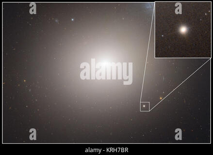 Dieser NASA/ESA Hubble Space Telescope Bild zeigt die massiven elliptische Galaxie Messier 60 (auch als M 60 oder NGC 4649). M60 ist 120 Millionen Lichtjahre und enthält schätzungsweise 400 Milliarden Sterne. In der Einfügung markiert ist der Zwerg Galaxie M 60-UDC1, umkreist die elliptische Riesengalaxie. Lügen über 50 Millionen Lichtjahre entfernten, M60-UCD 1 ist eine winzige Galaxie mit einem Durchmesser von 300 Lichtjahren - nur 1/500stel des Durchmessers der Milchstraße! Trotz seiner Größe ist ziemlich überfüllt ist mit rund 140 Millionen Sterne. Die Zwerggalaxie kann tatsächlich die abisolierten Überrest eines größeren Galaxie das war Stockfoto