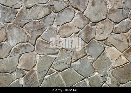 Fragment einer antiken Mauer von Steinen. (Hintergrundbild) Stockfoto