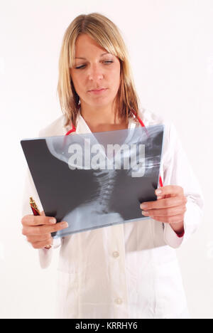 Ƒrztin Betrachtet Roentgenbild, Halswirbelroentgen - Frau Doktor mit x-ray Stockfoto