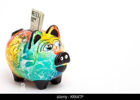 Speichern von Dollar in eine bunte Sparschwein - Seitenansicht Stockfoto