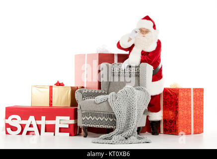 Santa Claus mit Verkauf Zeichen Stockfoto