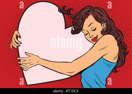 Schöne junge Frau umarmt Valentine Herz Stockfoto