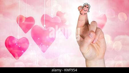 Valentine's Finger lieben paar und hängende Herzen Stockfoto