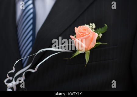 Knopfloch-rose Detail des Bräutigams Hochzeit dressup Stockfoto