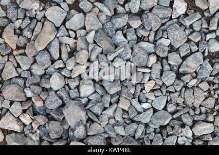 Kies Textur Hintergrund. Schotterpiste. Farbe grau. Stockfoto