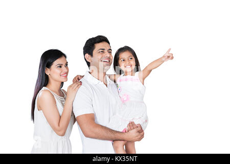 Glückliche Familie, Kind und Eltern Tochter Zeigefinger zeigen Genießen Stockfoto