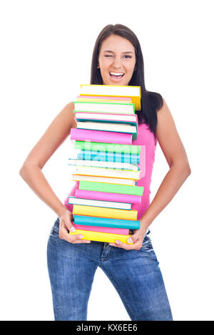 Mädchen mit großen Stapel Bücher und winking, auf weißem Hintergrund Stockfoto