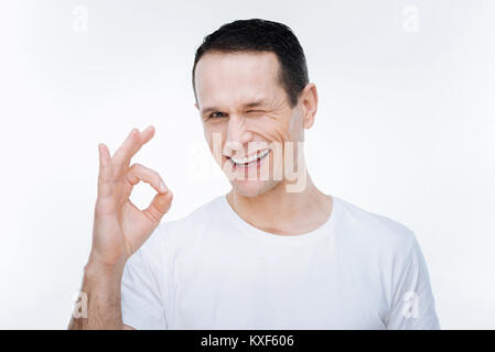 Freut mich glücklicher Mann winking Stockfoto