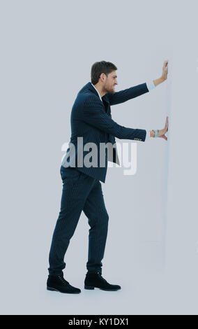 Man Druck auf die Wand. Stockfoto