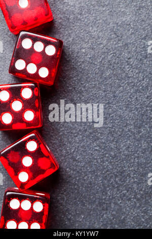 A set of red dice on a slate background. Betting and gambling concept Stockfoto