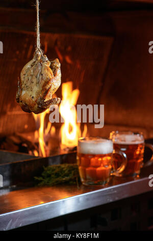 Gehängt Chicken Grill Stockfoto