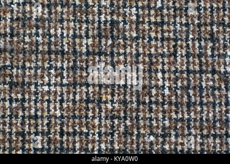 Wolle oder Tweed Textur Hintergrund. Stoff checkered in Braun. Houndstooth Textur. Stockfoto