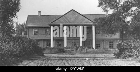 Das Foto von Parachonsk (Парахонск) aus dem Jahr 1930 zeigt eine kleine Siedlung mit ländlichen Wohnungen, unbefestigten Straßen und umliegenden Feldern, die eine Momentaufnahme des Dorflebens aus dem frühen 20. Jahrhundert in der Region darstellt. Stockfoto