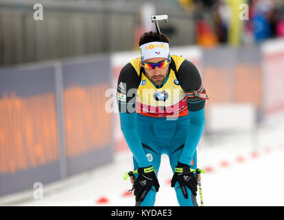 Ruhpolding, Deutschland. 14 Jan, 2017. Martin Fourcade aus Frankreich kommt am Ende der Masse der Männer (15 km) der Biathlon Weltcup in der Chiemgau Arena in Ruhpolding, Deutschland, 14. Januar 2017. Credit: Matthias Balk/dpa/Alamy leben Nachrichten Stockfoto