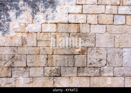 Hintergrund oder Textur aus Mauer mit Resten von Gips Stockfoto