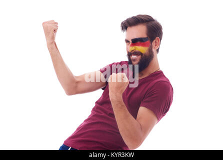 Fröhliche Fußballfan ballte die Faust Stockfoto