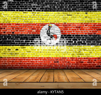 Uganda Fahne auf ziegelmauer mit Parkettboden lackiert Stockfoto