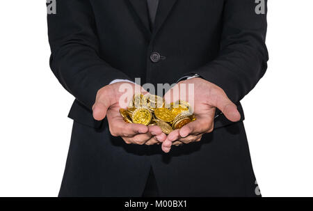 Eine Handvoll Münzen in die Hände Stockfoto