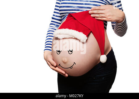 Schwangere Frau. Babybauch mit Weihnachtsmütze isoliert auf weißem Stockfoto