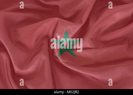 Marokko Flagge auf dem Stoff Textur Hintergrund Stockfoto