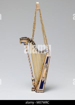 Diese Musikbox zeigt sowohl funktionale Musikspielmöglichkeiten als auch dekorative Handwerkskunst als Teil einer Museumssammlung. Stockfoto