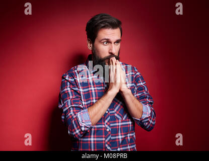 Besorgt man im Studio shot Beten Stockfoto