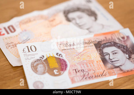 Ein neues Polymer £ 10 Hinweis Überlagerung ein altes Papier £ 10 Hinweis Stockfoto
