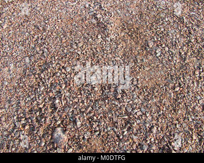 Abstrakte Makro grit Hintergrund - Oberfläche, mit kleinen Steinen bedeckt Stockfoto